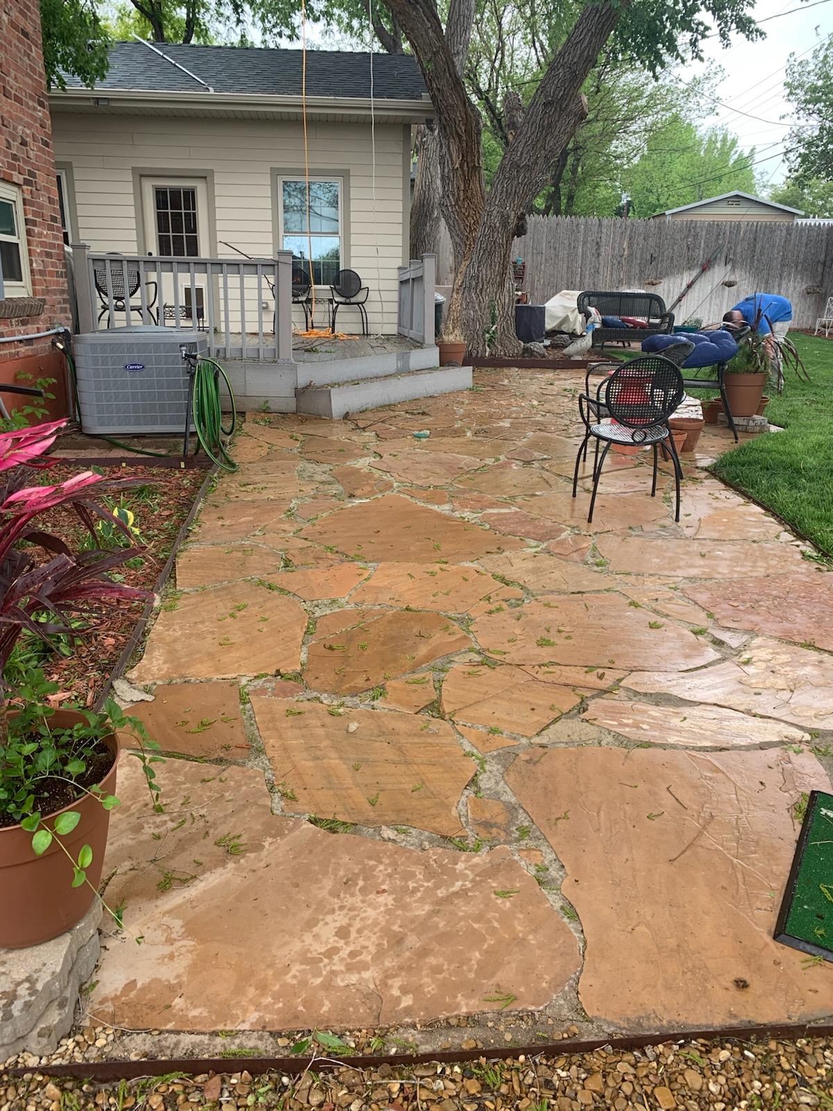 Large flagstone patio installation in progress